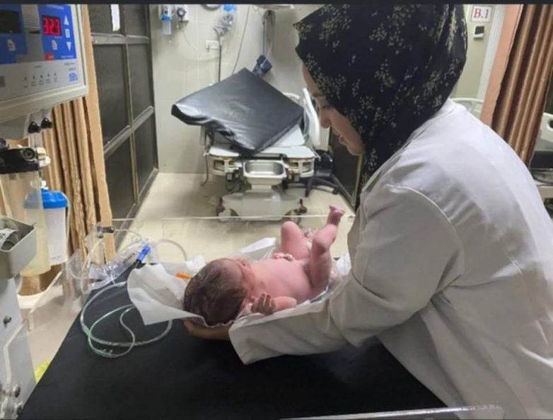 "Tragic Airstrike: Pregnant Doctor Killed While Aiding Gaza Families" humanitarian crisis Gaza, medical professionals in conflict zones, impact of airstrikes on civilians