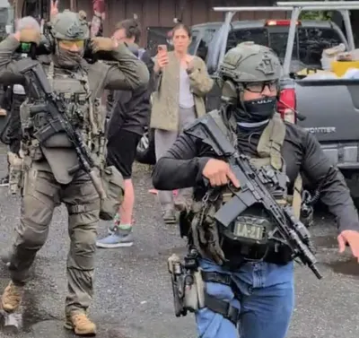 "America on Edge: Is Trump’s Regime Channeling Nazi Tactics?" Trump administration policies, immigration enforcement controversy, authoritarian regime criticism